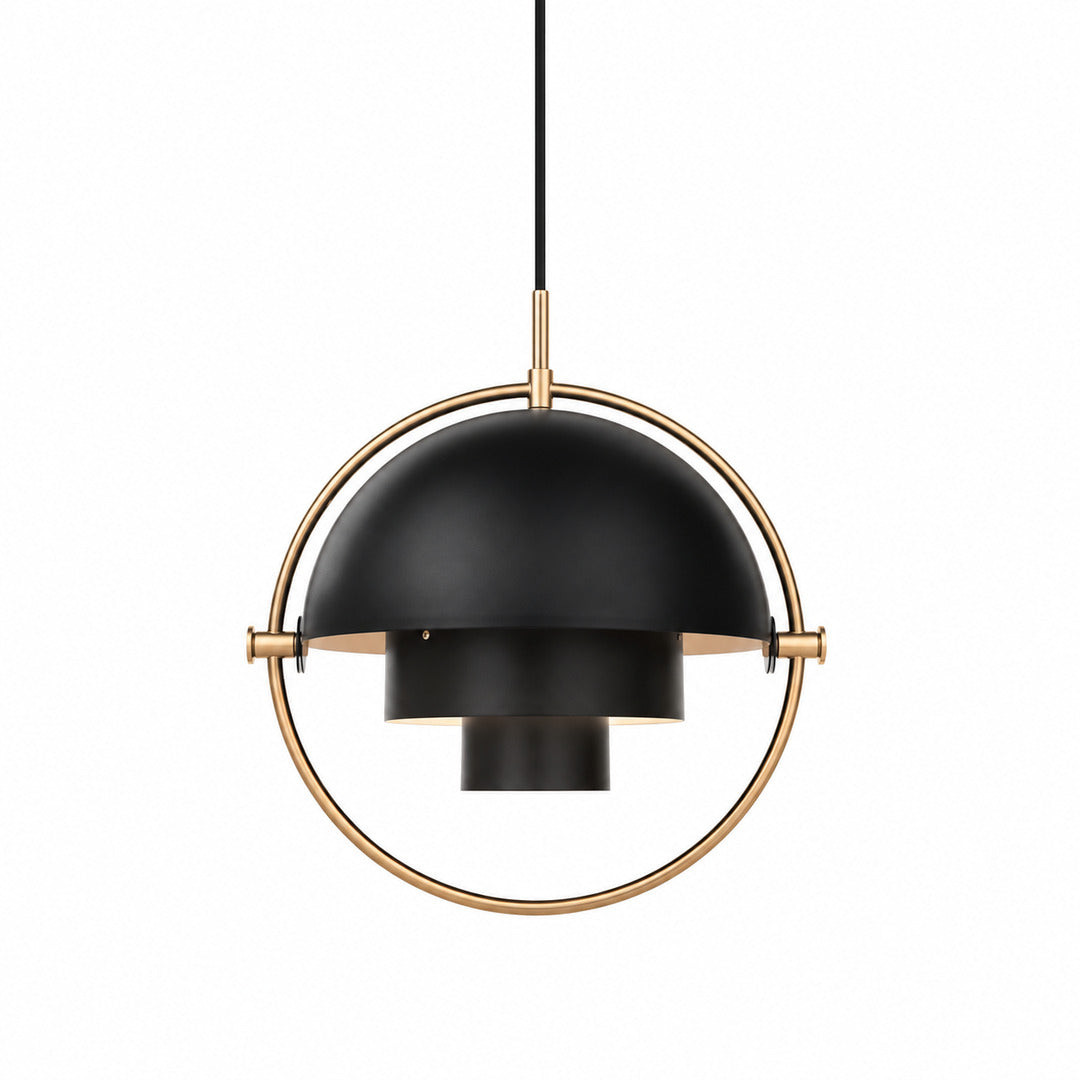 Emisfero pendant light with two pivoting metal hemispheres in a ring frame glowing warm over a table