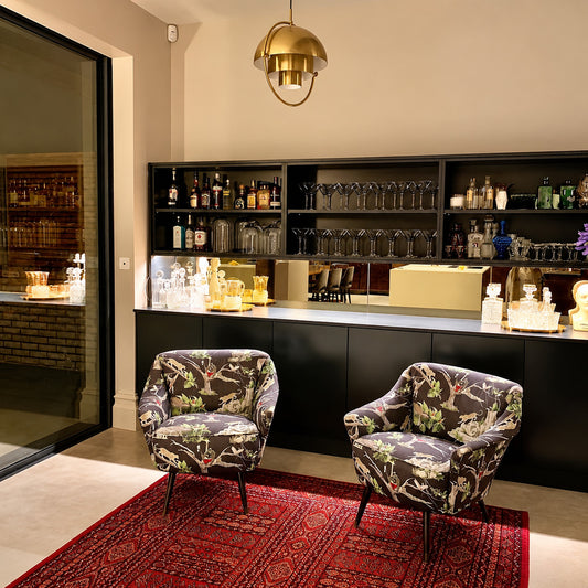 Copper Emisfero hemisphere pendant lights over a basement bar as a stylish accent