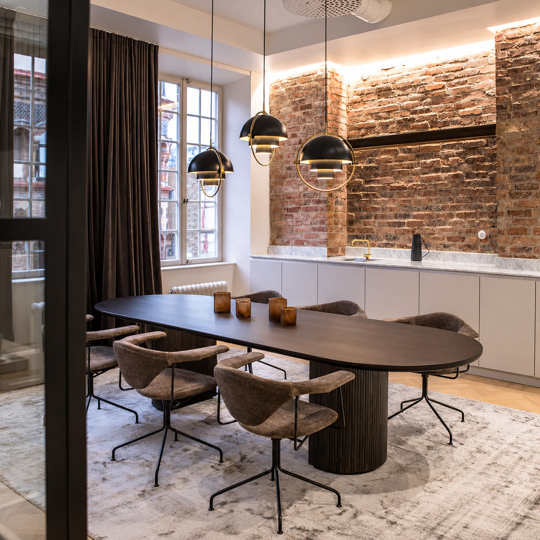 Row of Emisfero hemisphere pendant lights over tables in a mid-century modern restaurant