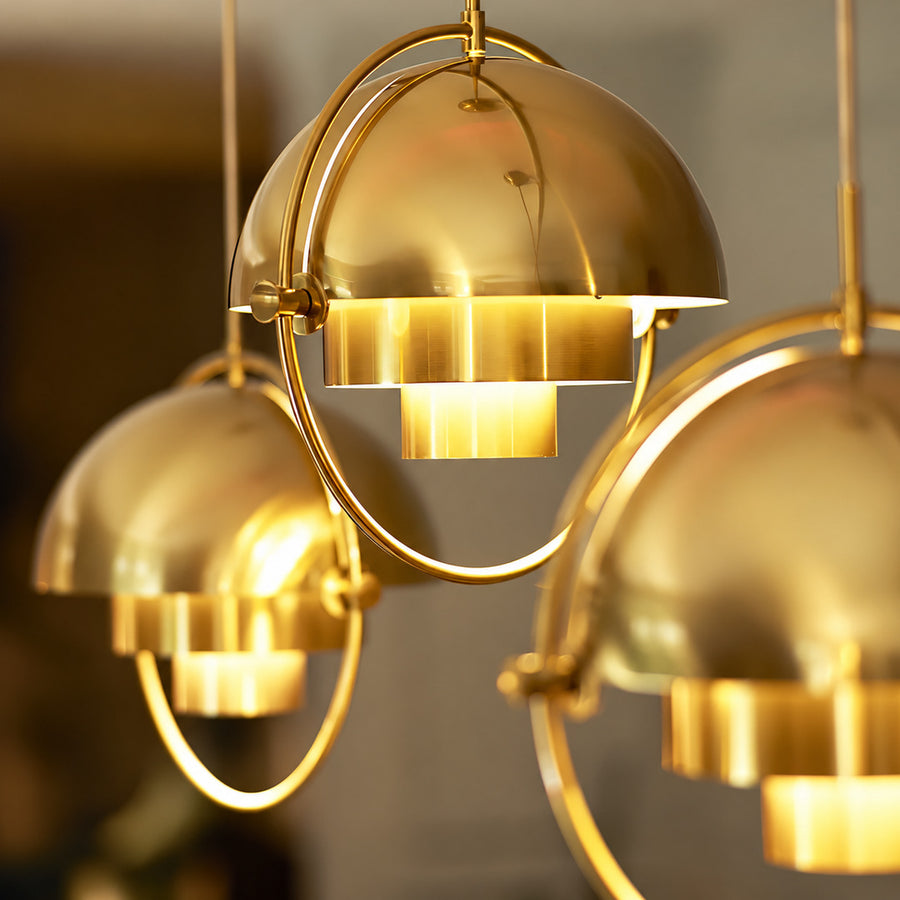 Copper Emisfero hemisphere pendant light highlighting a mid-century retail boutique