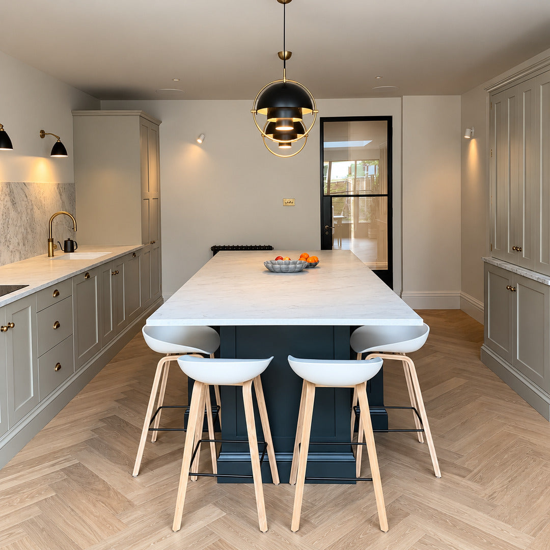 Emisfero pendant light casting adjustable warm light over a contemporary dining table