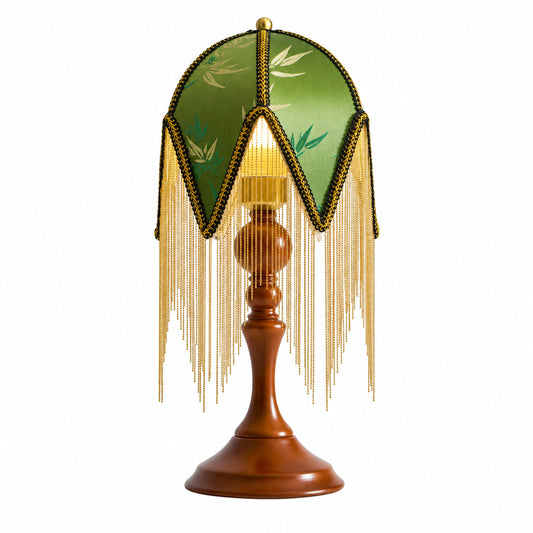 Nappa vintage table lamp with a beaded-fringe botanical shade and walnut wood base glowing warm on a nightstand