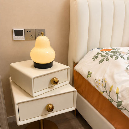 Nashi table lamp cream modern bedroom bedside reading warm 3000K glow cordless pear shaped USB rechargeable intimate cozy lifestyle interior American home