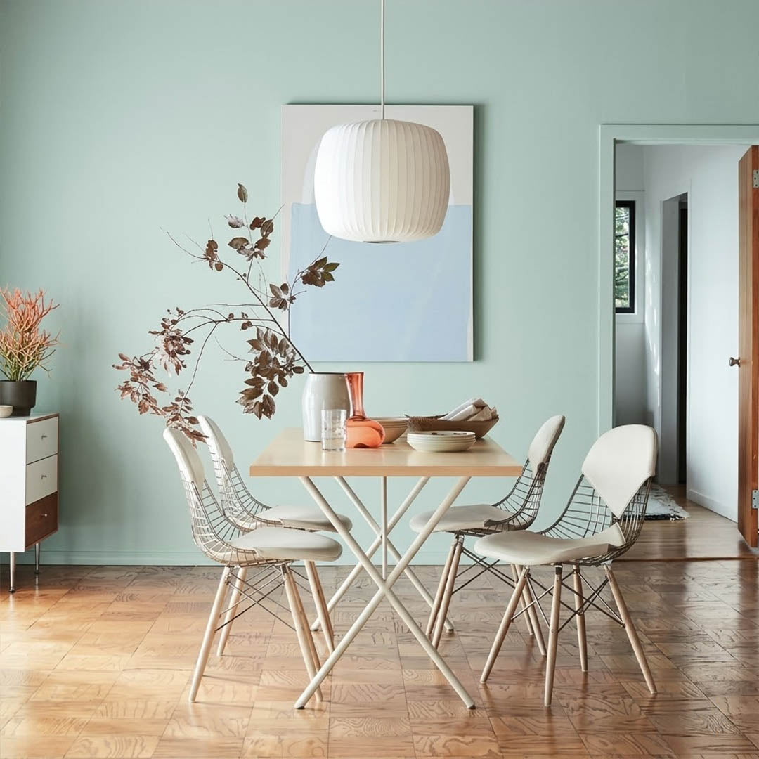 Nelson style bubble Saucer pendant 24 inch above Mid Century dining table Eames era furniture warm white glow modern interior