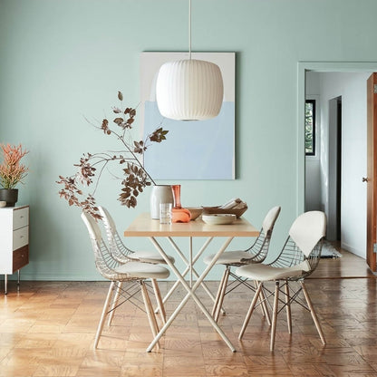 Nelson style bubble Saucer pendant 24 inch above Mid Century dining table Eames era furniture warm white glow modern interior