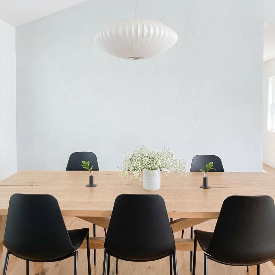Nelson style bubble Saucer pendant 24 inch above Mid Century dining table Eames era furniture warm white glow modern interior