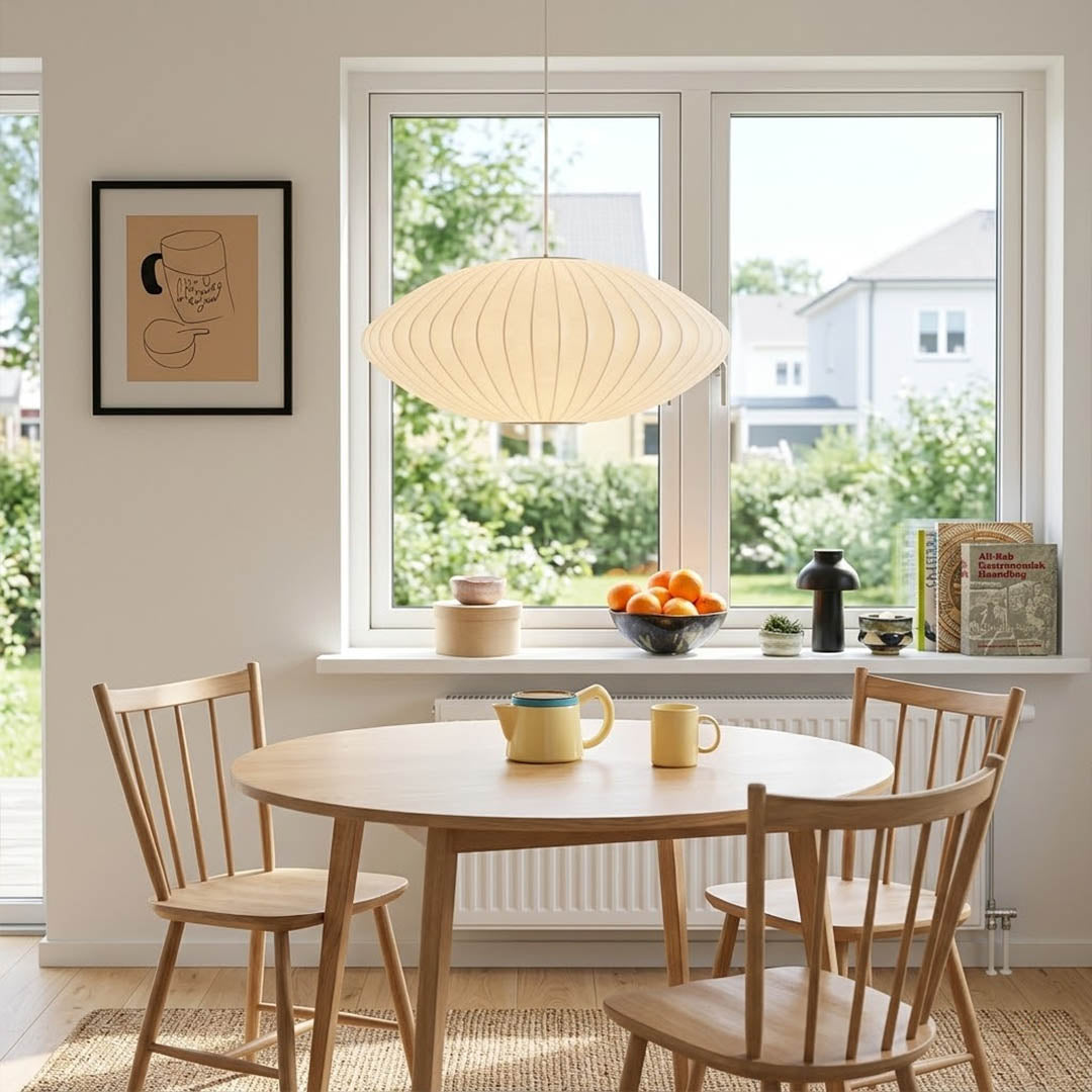 Nelson style bubble Saucer pendant 24 inch above Mid Century dining table Eames era furniture warm white glow modern interior