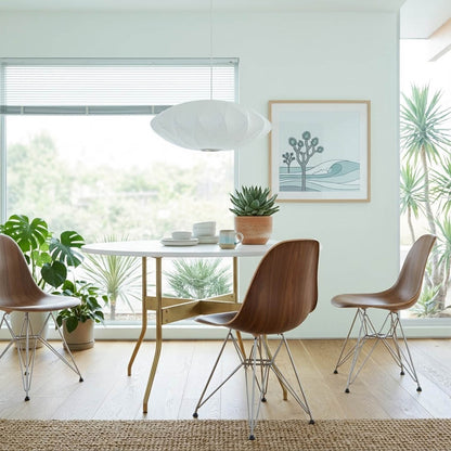 Nelson style bubble Saucer pendant 24 inch above Mid Century dining table Eames era furniture warm white glow modern interior