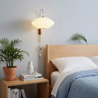 Nelson style bubble wall sconce pair bedside primary bedroom mid century modern plug in walnut wood arm warm glow interior