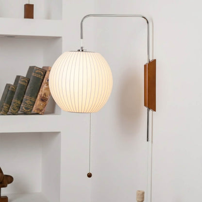 Nelson style wall sconce swivel pivot rotating arm walnut wood adjustable reading direction close up detail