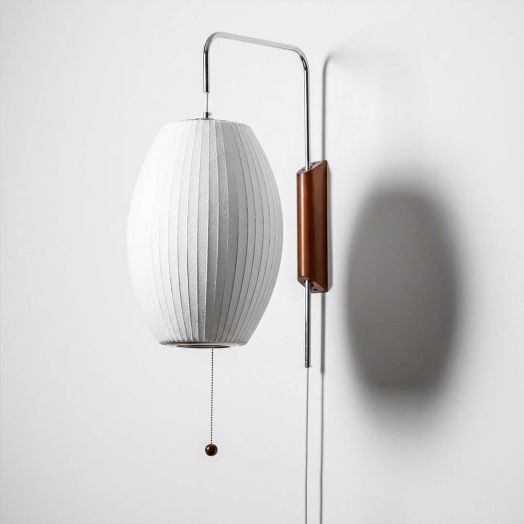 Nelson style wall sconce swivel pivot rotating arm walnut wood adjustable reading direction close up detail