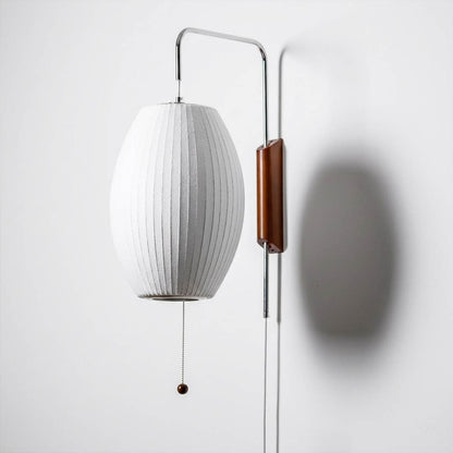 Nelson style wall sconce swivel pivot rotating arm walnut wood adjustable reading direction close up detail