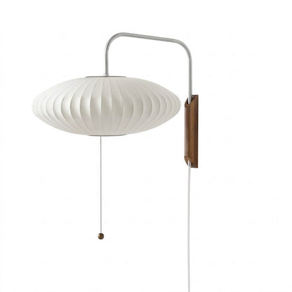 Nelson style bubble wall sconce Saucer Model D 16 inch flat wide white polymer walnut wood arm plug in mid century white background