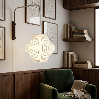 Nelson style bubble wall sconce reading corner armchair living room swivel adjustable mid century modern warm glow interior