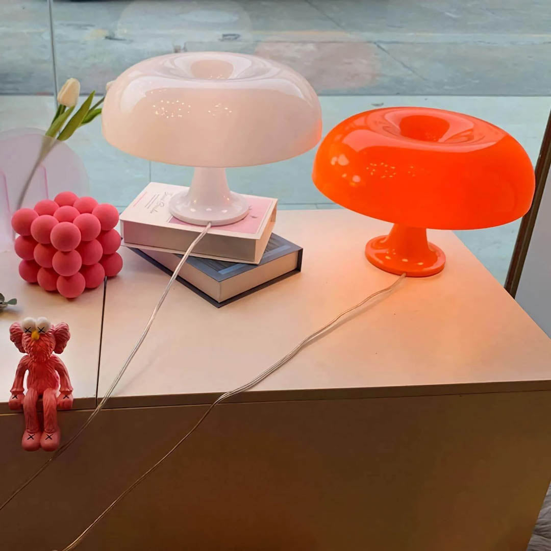 Nesso table lamp illuminated soft warm ambient glow evening bedside cozy mood 1965 Italian mushroom design icon Compasso d'Oro sophisticated intimate American home lifestyle interior