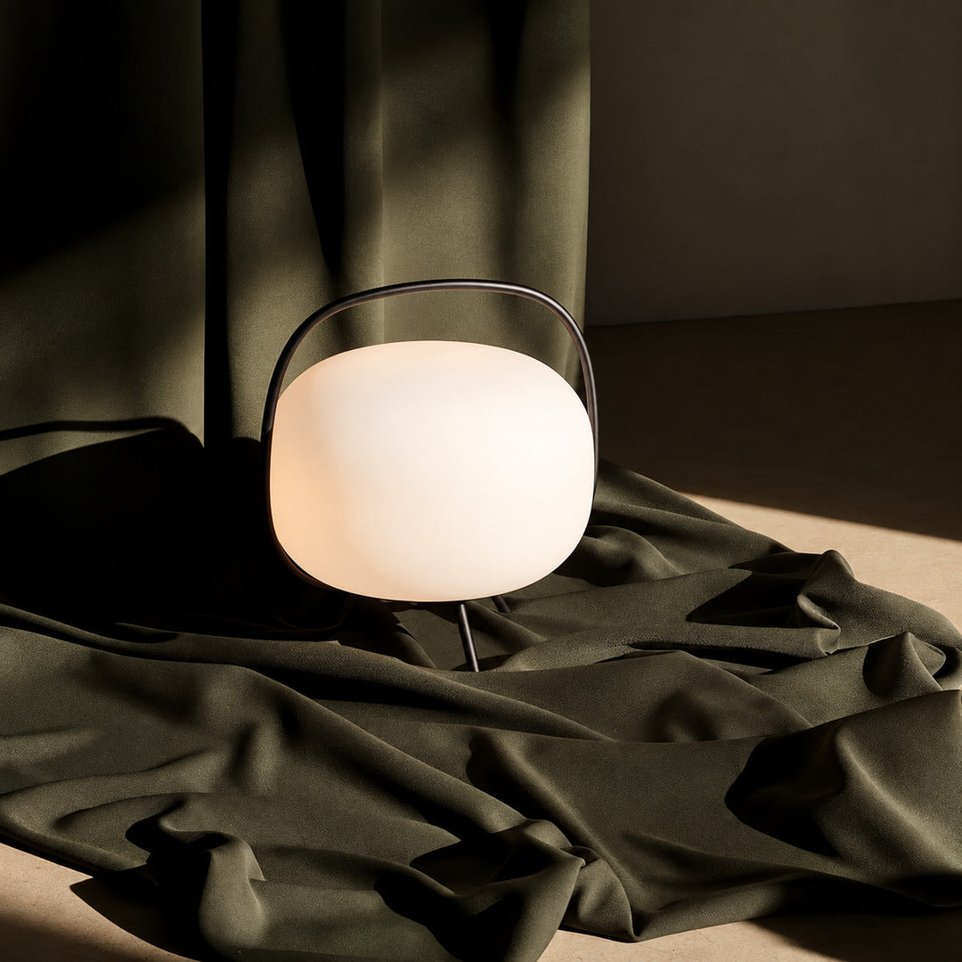 Nomade glass table lamp blending into a warm modern transitional living room