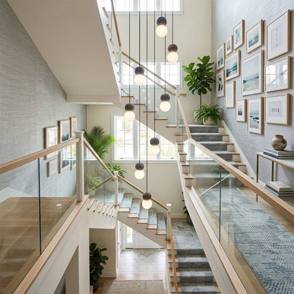 Norra concrete mini pendant cluster staircase stairwell vertical hanging different heights statement modern interior