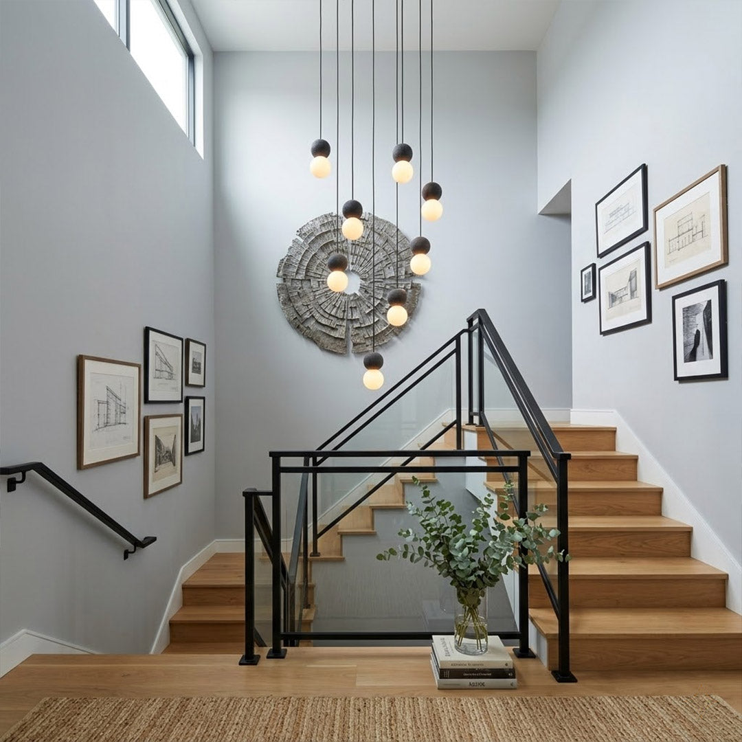 Norra concrete mini pendant cluster staircase stairwell vertical hanging different heights statement modern interior