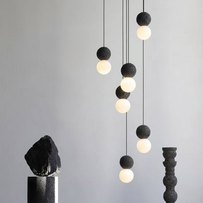 Norra concrete mini pendant cluster staircase stairwell vertical hanging different heights statement modern interior