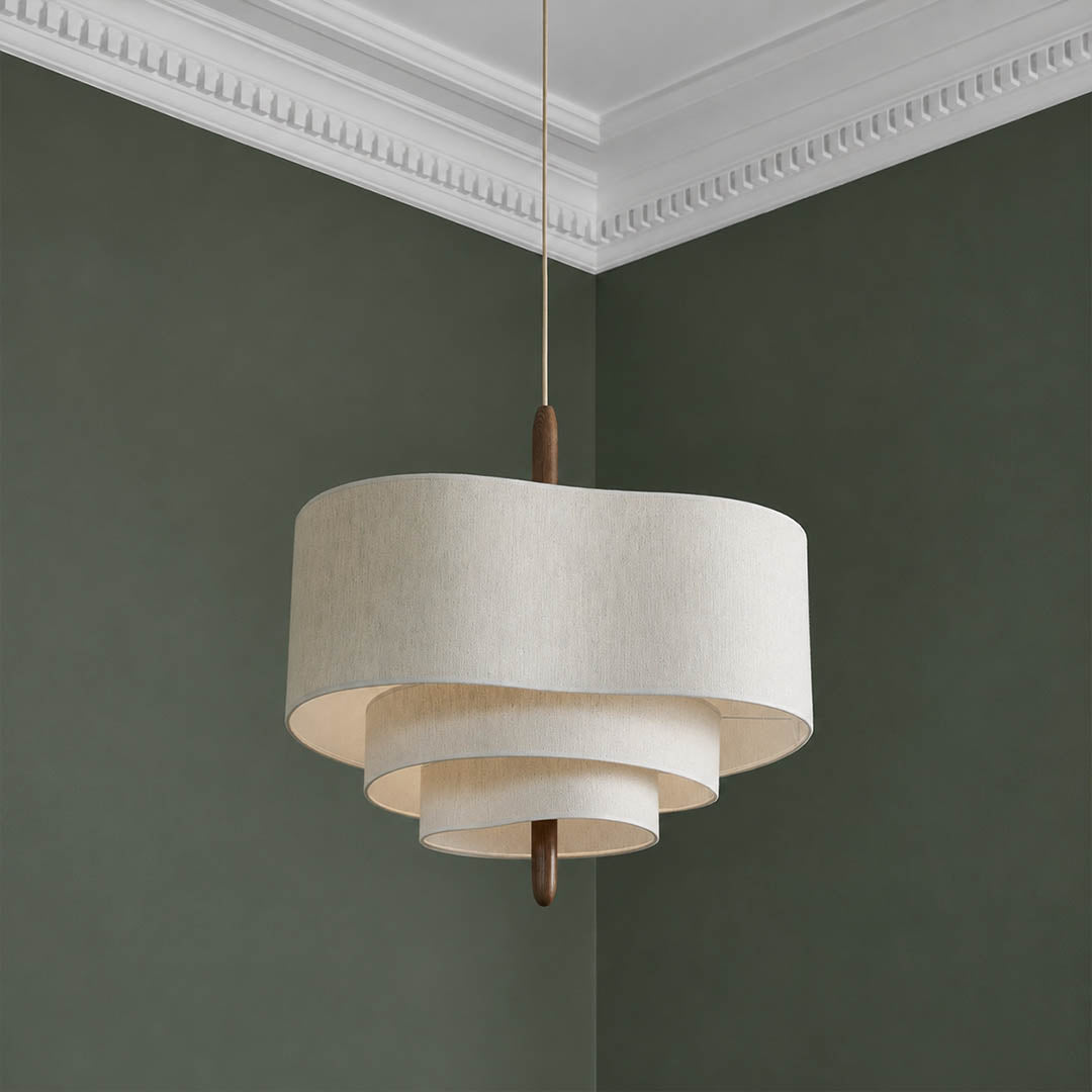 Nuvola pendant light illuminated warm ambient soft off-white glow multi-layered fabric shade evening cozy sophisticated mid-century boho detail close up mood
