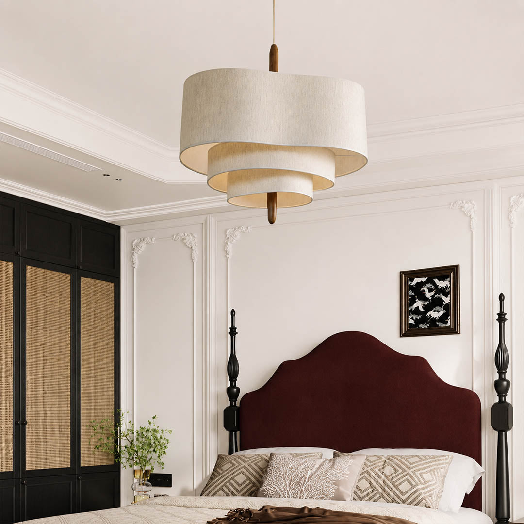 Nuvola pendant light medium modern primary bedroom over bed statement hanging soft multi-layered fabric shade walnut accent mid-century boho warm ambient intimate cozy sophisticated American home lifestyle interior
