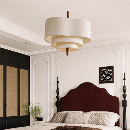 Nuvola pendant light medium modern primary bedroom over bed statement hanging soft multi-layered fabric shade walnut accent mid-century boho warm ambient intimate cozy sophisticated American home lifestyle interior