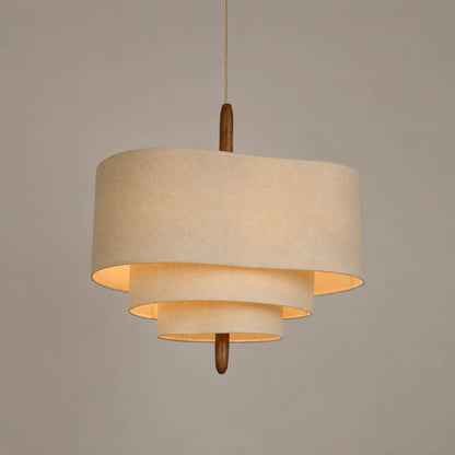 Nuvola pendant light medium 22.8 inch diameter multi-layered off-white fabric shade walnut wood accent mid-century modern boho Japandi soft warm dining bedroom white background