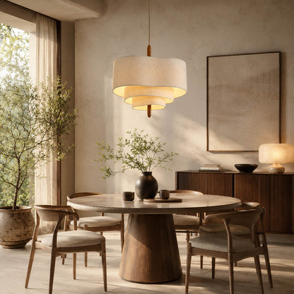 Nuvola pendant light medium modern round dining table hanging soft multi-layered fabric shade walnut accent mid-century boho warm ambient evening entertaining sophisticated American home lifestyle interior