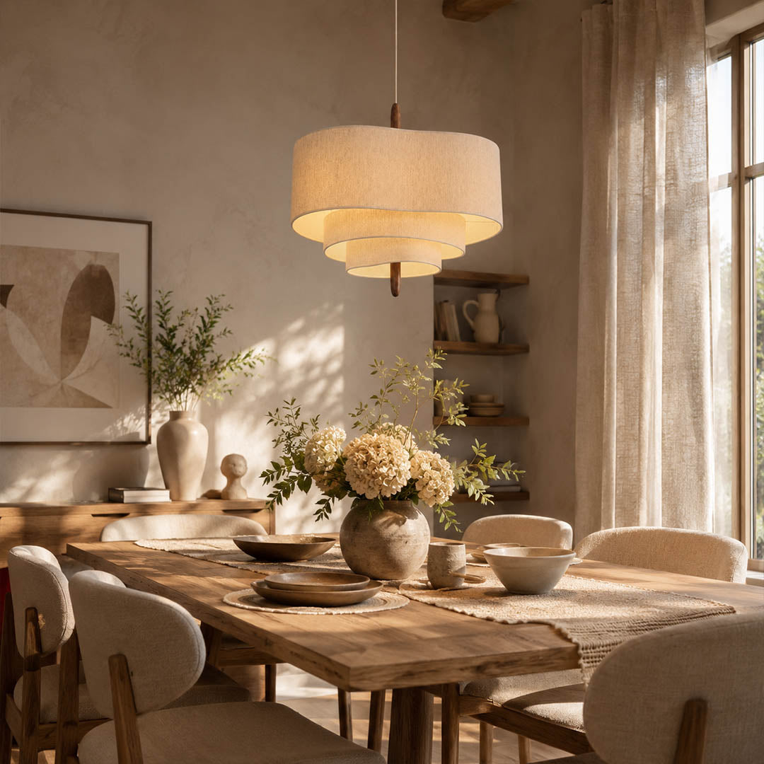 Nuvola pendant light medium modern dining room rectangular table hanging soft multi-layered fabric shade walnut accent mid-century boho warm ambient sophisticated cozy American home lifestyle interior
