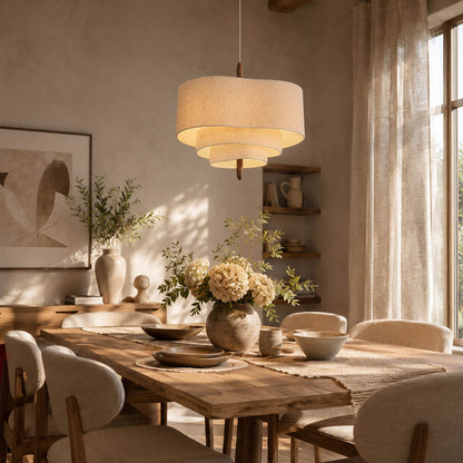 Nuvola pendant light medium modern dining room rectangular table hanging soft multi-layered fabric shade walnut accent mid-century boho warm ambient sophisticated cozy American home lifestyle interior