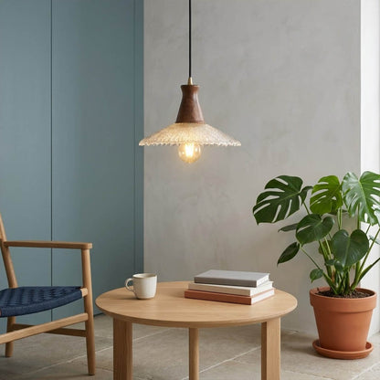 Olive pendant light above small dining table cozy warm glass wood transitional interior