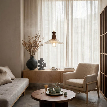 Olive pendant light above small dining table cozy warm glass wood transitional interior