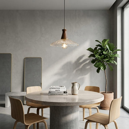 Olive pendant light above small dining table cozy warm glass wood transitional interior