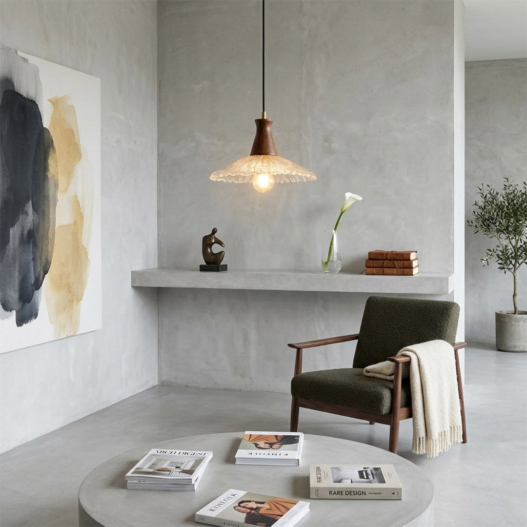Olive pendant light above small dining table cozy warm glass wood transitional interior
