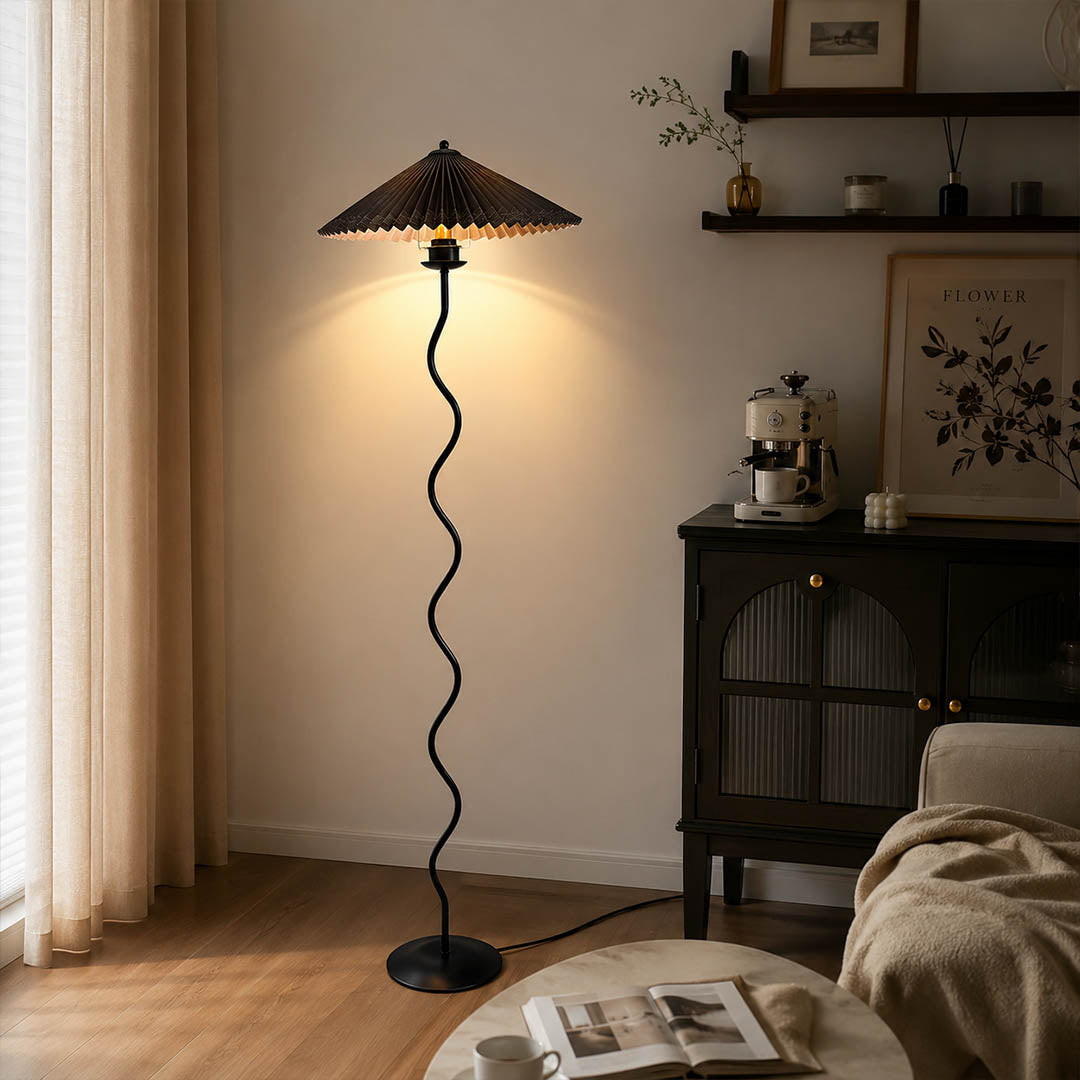 Onda floor lamp beige modern reading corner armchair sculptural squiggle wavy black metal base fabric drum shade postmodern Memphis inspired warm cozy ambient lifestyle interior