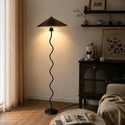 Onda floor lamp beige modern reading corner armchair sculptural squiggle wavy black metal base fabric drum shade postmodern Memphis inspired warm cozy ambient lifestyle interior