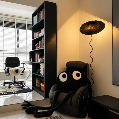 Onda floor lamp beige modern reading corner armchair sculptural squiggle wavy black metal base fabric drum shade postmodern Memphis inspired warm cozy ambient lifestyle interior