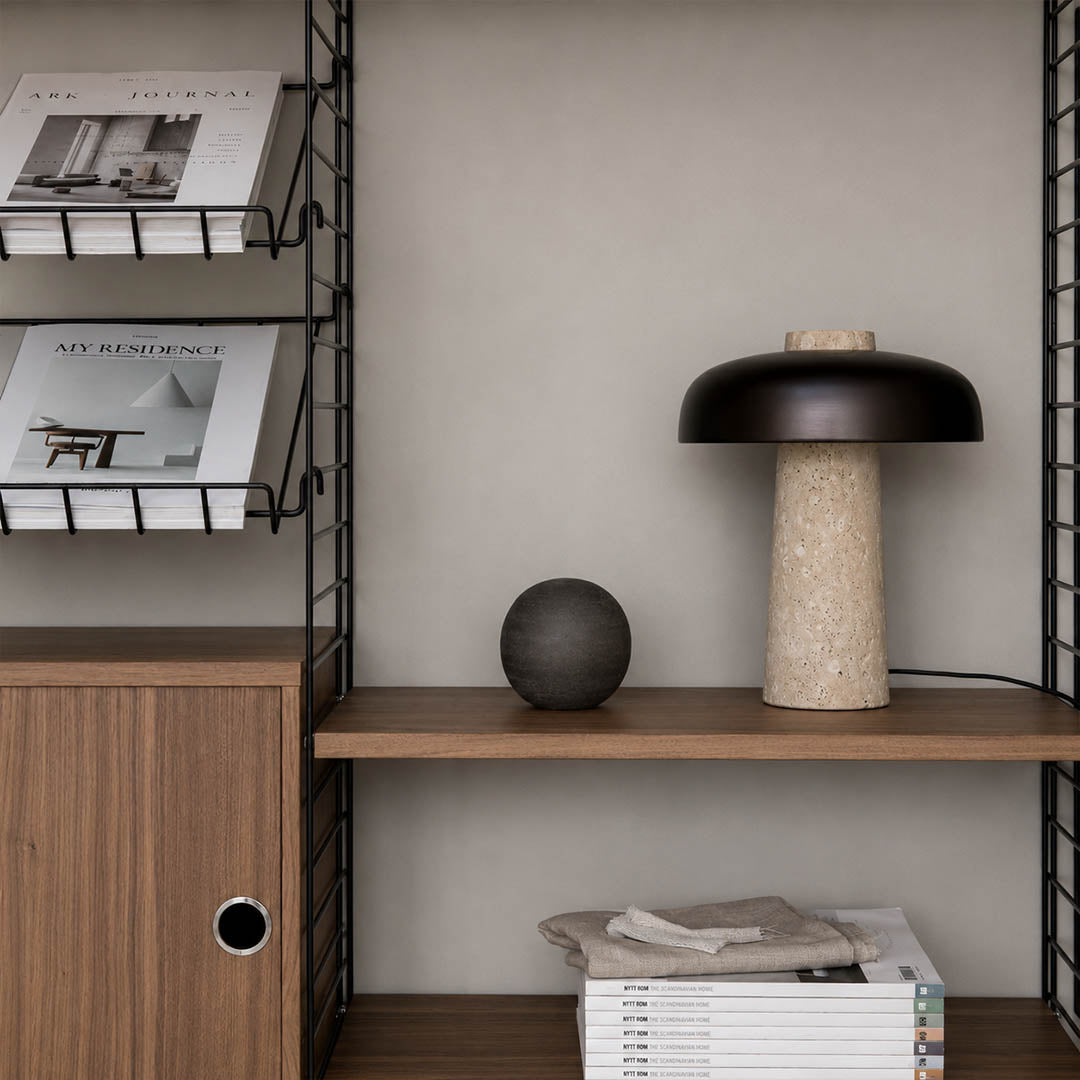 Onda small travertine dome table lamp modern industrial bedside nightstand primary master bedroom minimalist matte black walnut wood warm glow lifestyle interior