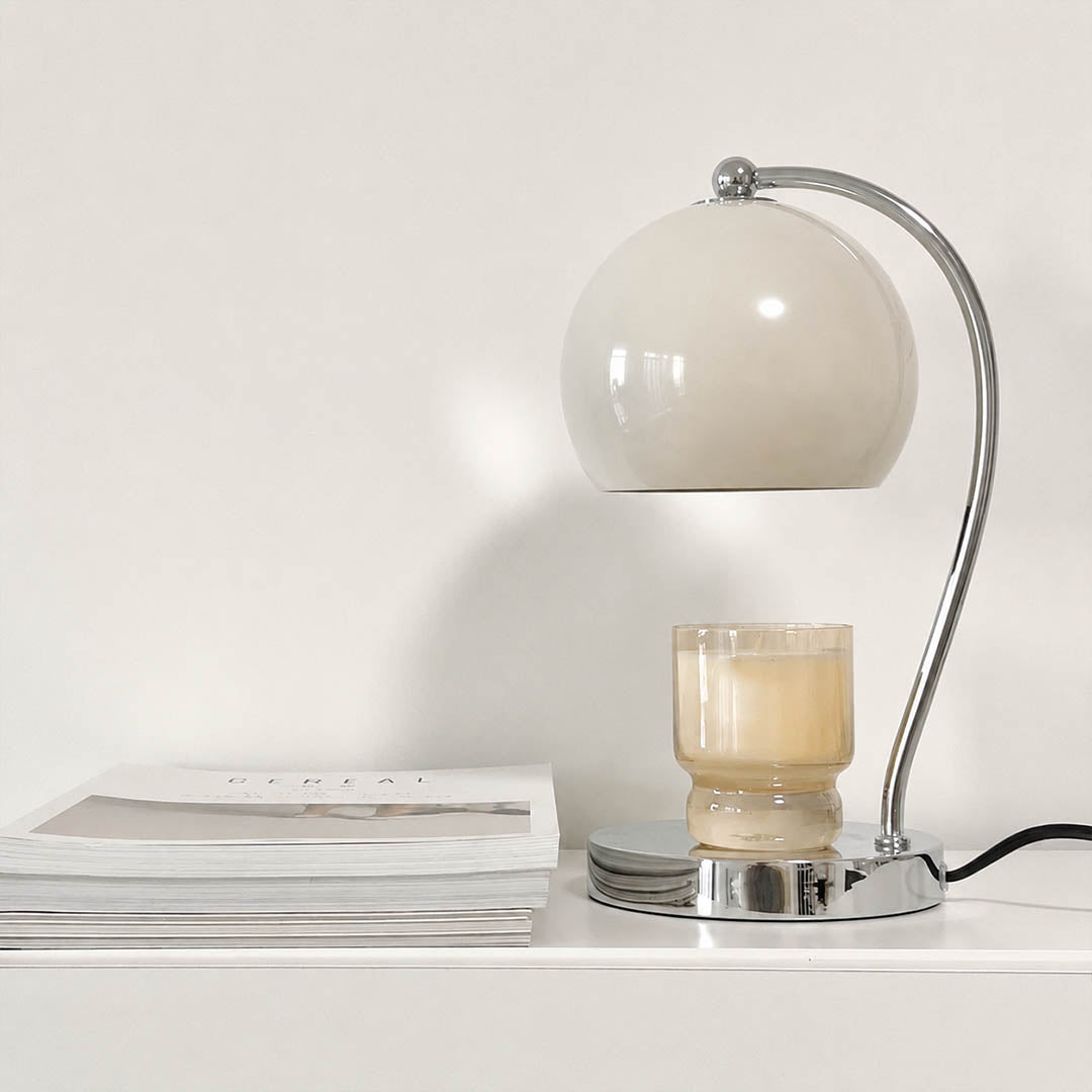 Orbet sphere candle warmer lamp entryway console scent warming warm glow chrome cute American home lifestyle interior styled