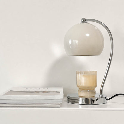 Orbet sphere candle warmer lamp entryway console scent warming warm glow chrome cute American home lifestyle interior styled