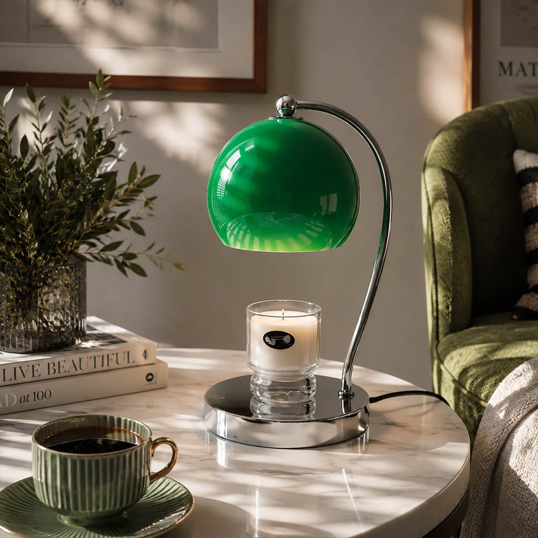 Orbet sphere candle warmer lamp living room side table scent warming warm glow chrome cute modern American home lifestyle interior styled