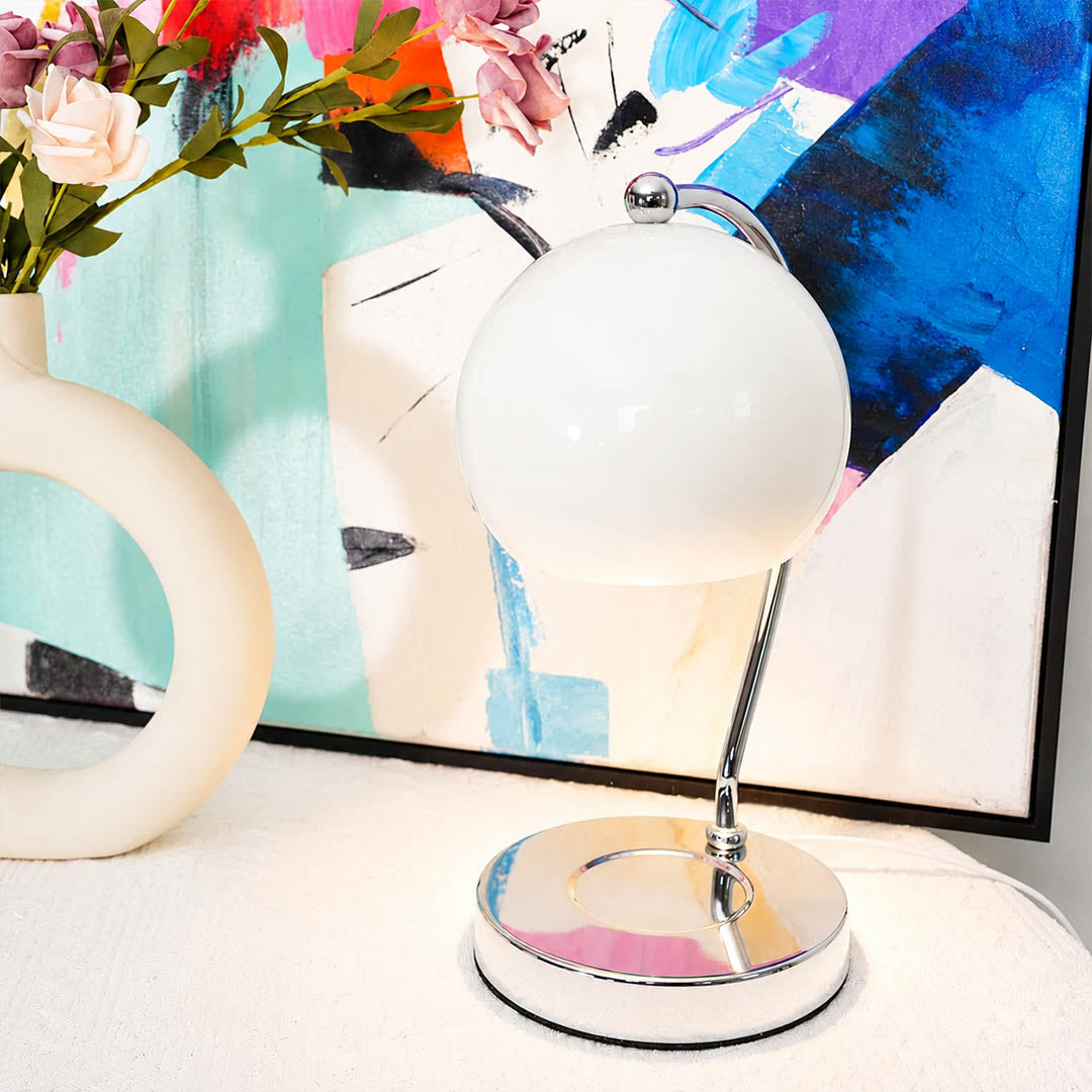Orbet sphere candle warmer lamp living room side table scent warming warm glow chrome cute modern American home lifestyle interior styled
