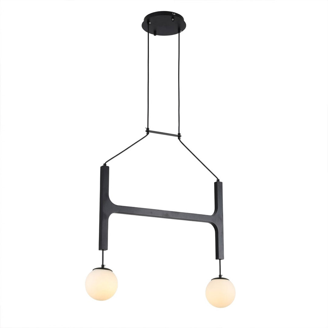 Orbit walnut orb chandelier above dining table warm frosted globe glow organic modern interior