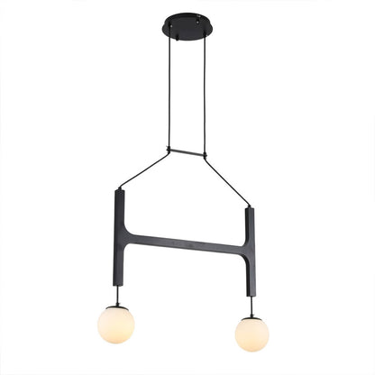 Orbit walnut orb chandelier above dining table warm frosted globe glow organic modern interior