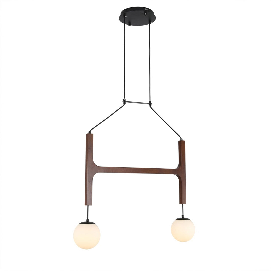 Orbit walnut orb chandelier above dining table warm frosted globe glow organic modern interior