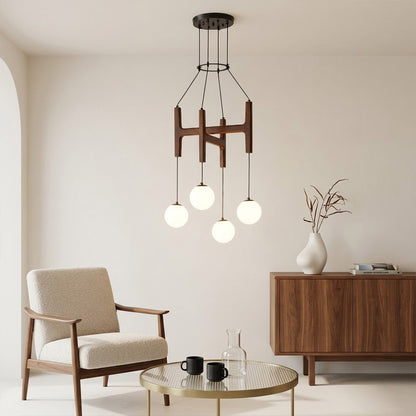 Orbit walnut orb chandelier above dining table warm frosted globe glow organic modern interior