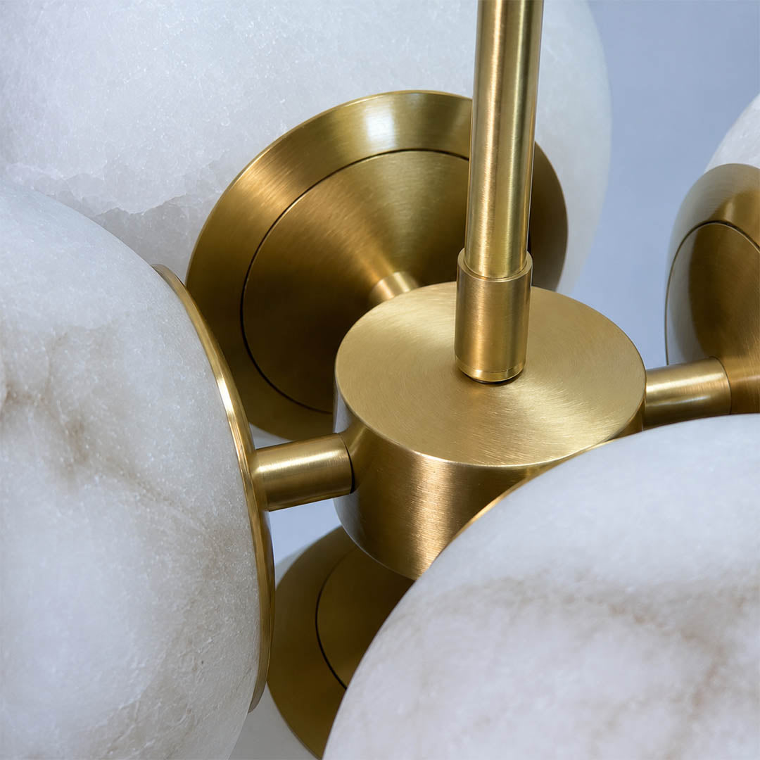 Orbita alabaster globe pendant light polished brass rod hardware fitting detail close up luxurious refined mid century