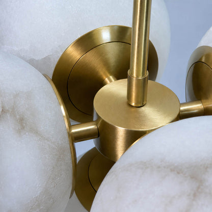 Orbita alabaster globe pendant light polished brass rod hardware fitting detail close up luxurious refined mid century