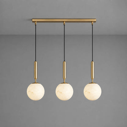Orbita alabaster globe pendant light three balls linear natural stone spheres brass rods white background front view