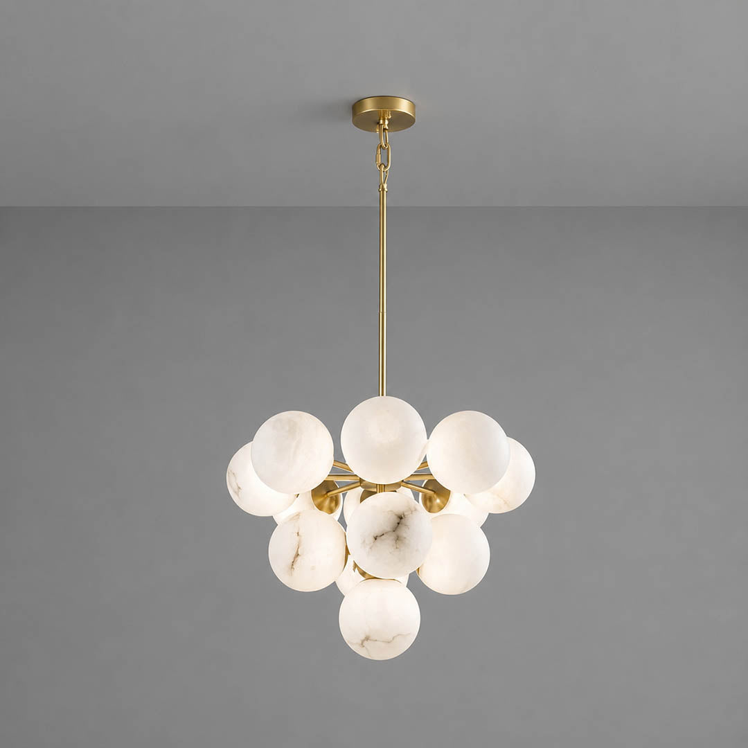 Orbita alabaster globe pendant light thirteen balls grand cluster natural stone spheres brass galactic statement white background front view